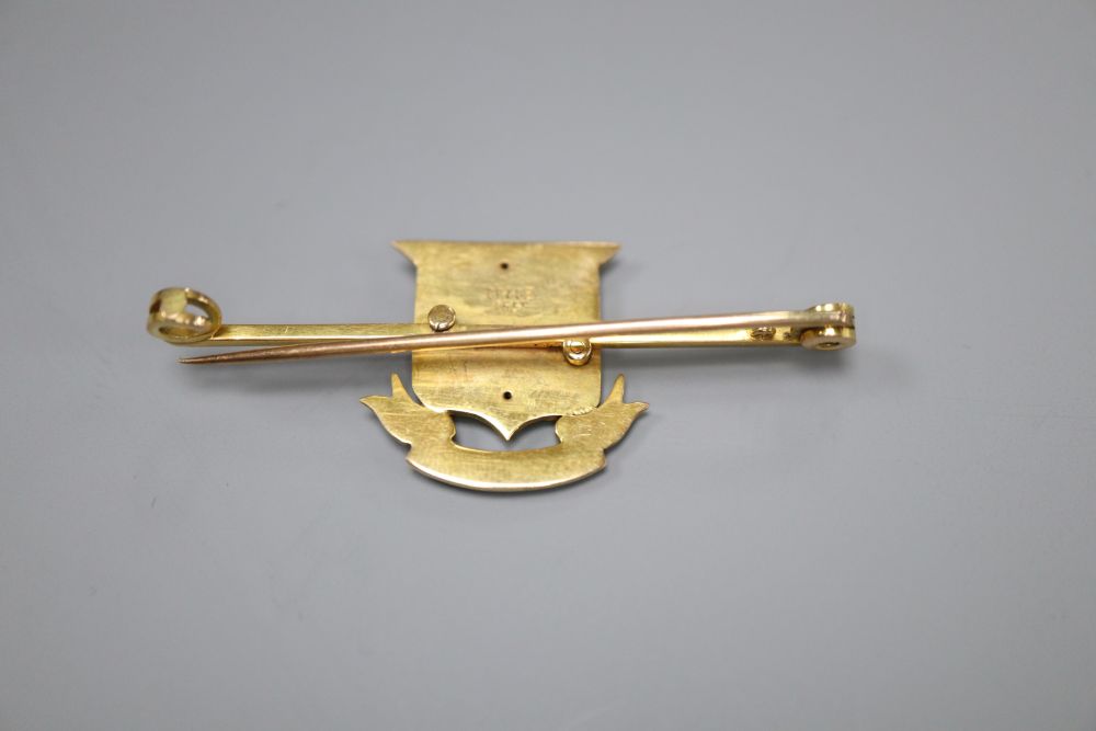 An early 20th century 15ct and enamel Army Ordnance Department bar brooch, 47mm, gross 4.8 grams.